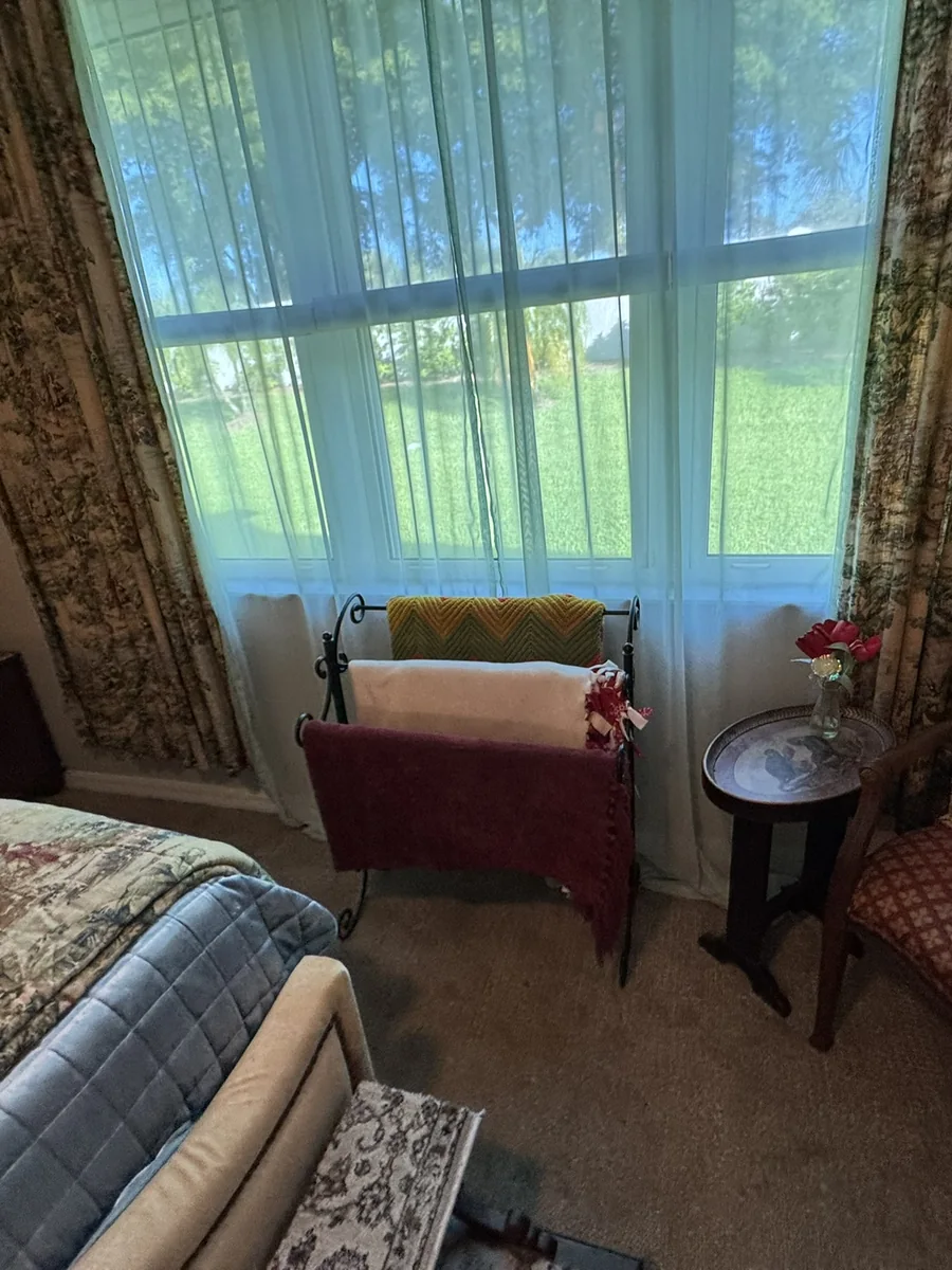 Bedroom before a residential cleaning and turnover reset
