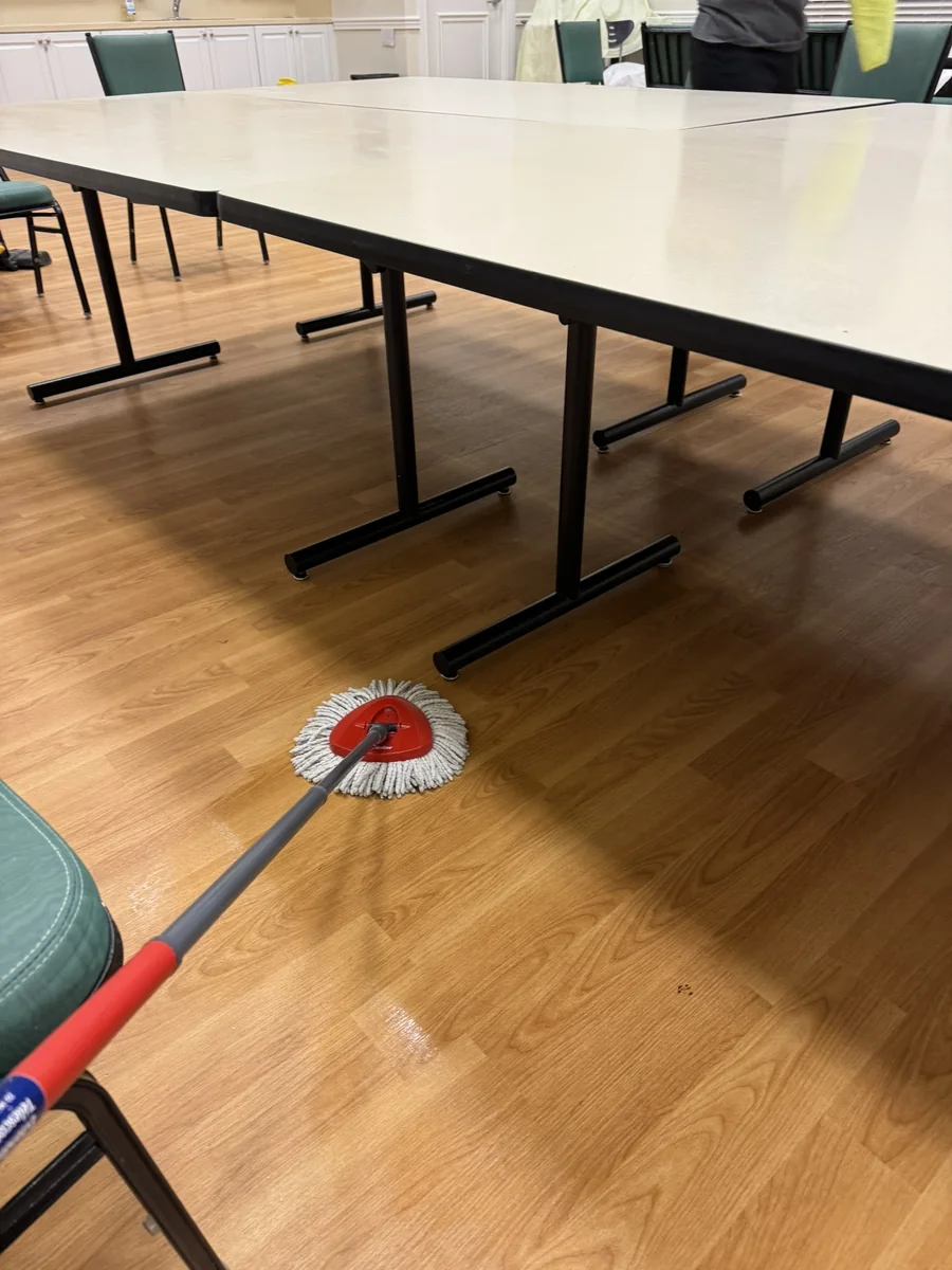 Clubhouse floor being cleaned during commercial cleaning service