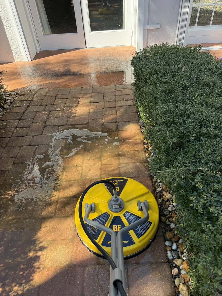 Paver walkway with buildup before pressure washing