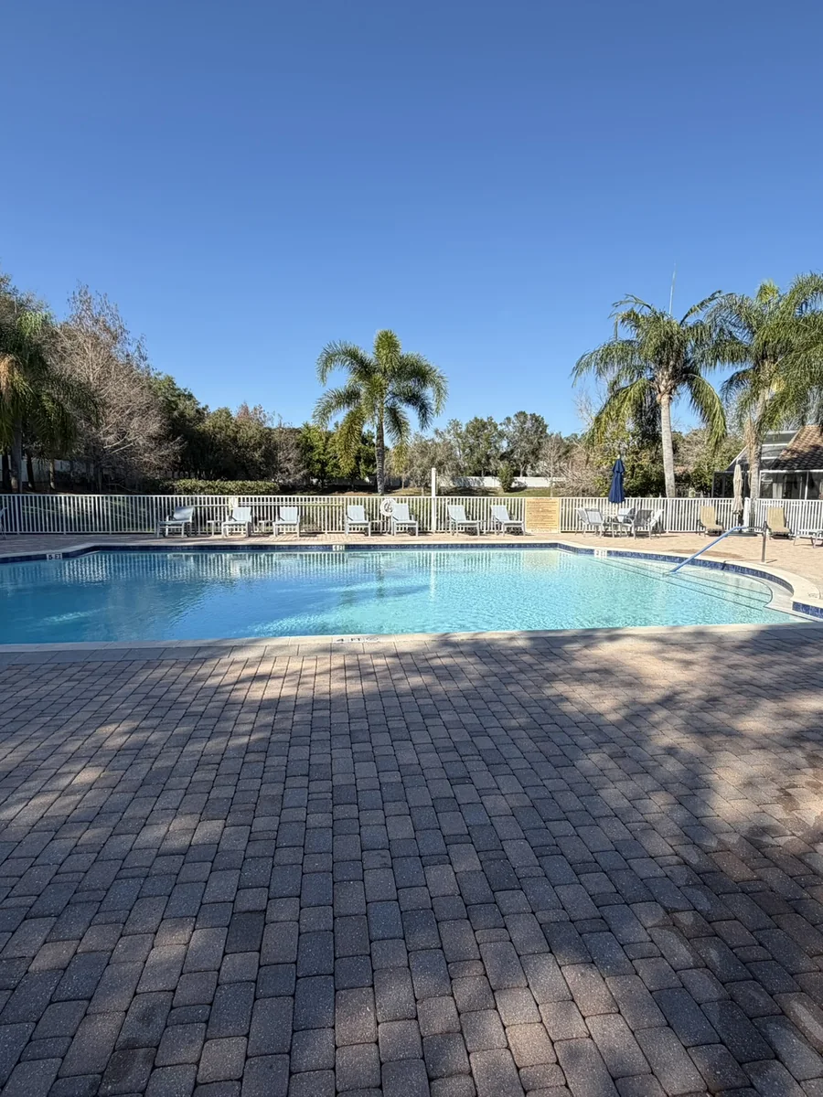 Community pool deck and pavers cleaned after pressure washing