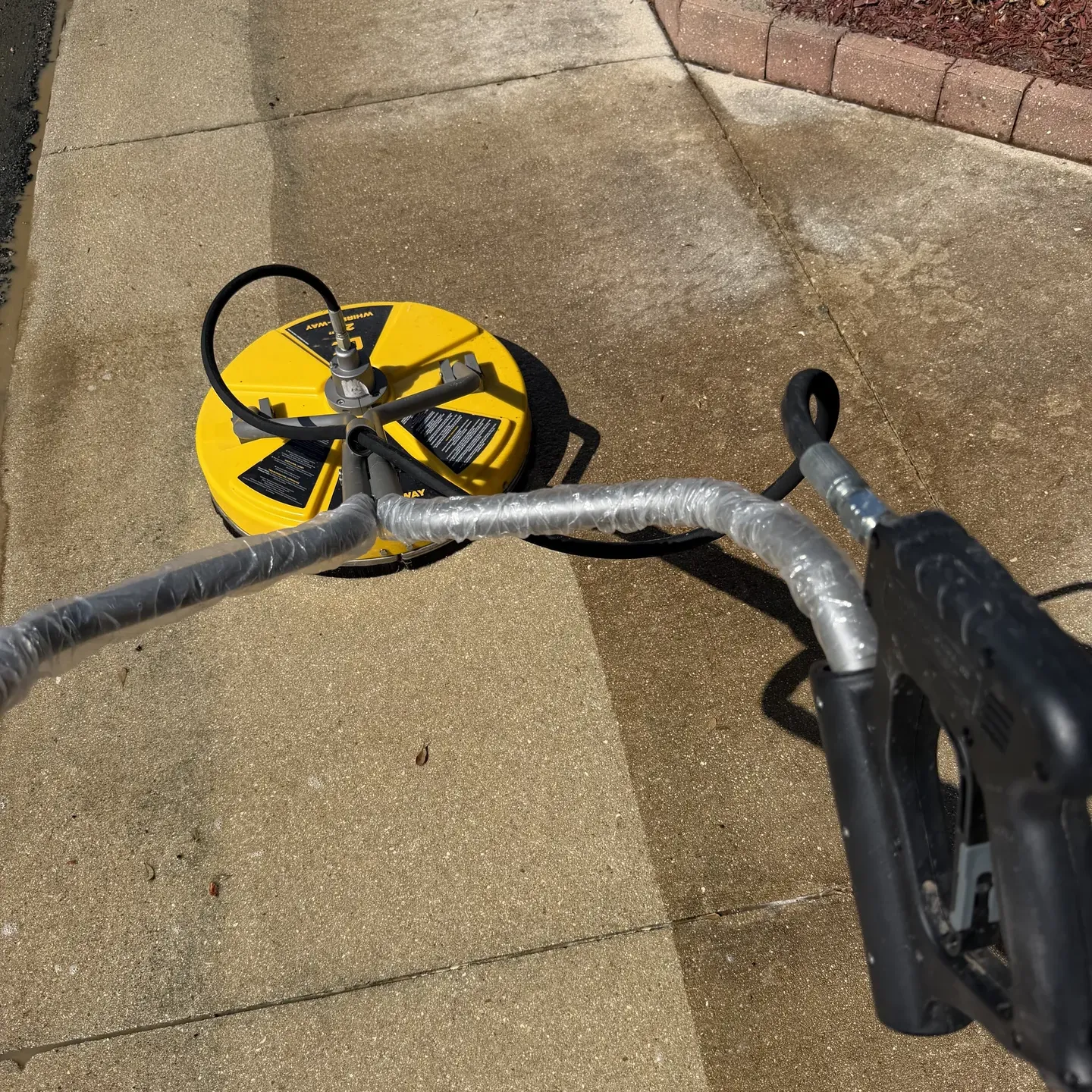 Clean driveway after professional pressure washing